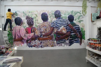 Brett Cook, putting finishing touches on the mural for the University of Lagos, 2012